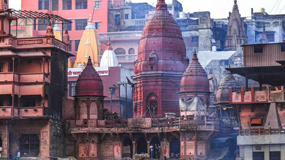 Varanasi in India, pilgrims bathe in the sacred river, perform rituals,